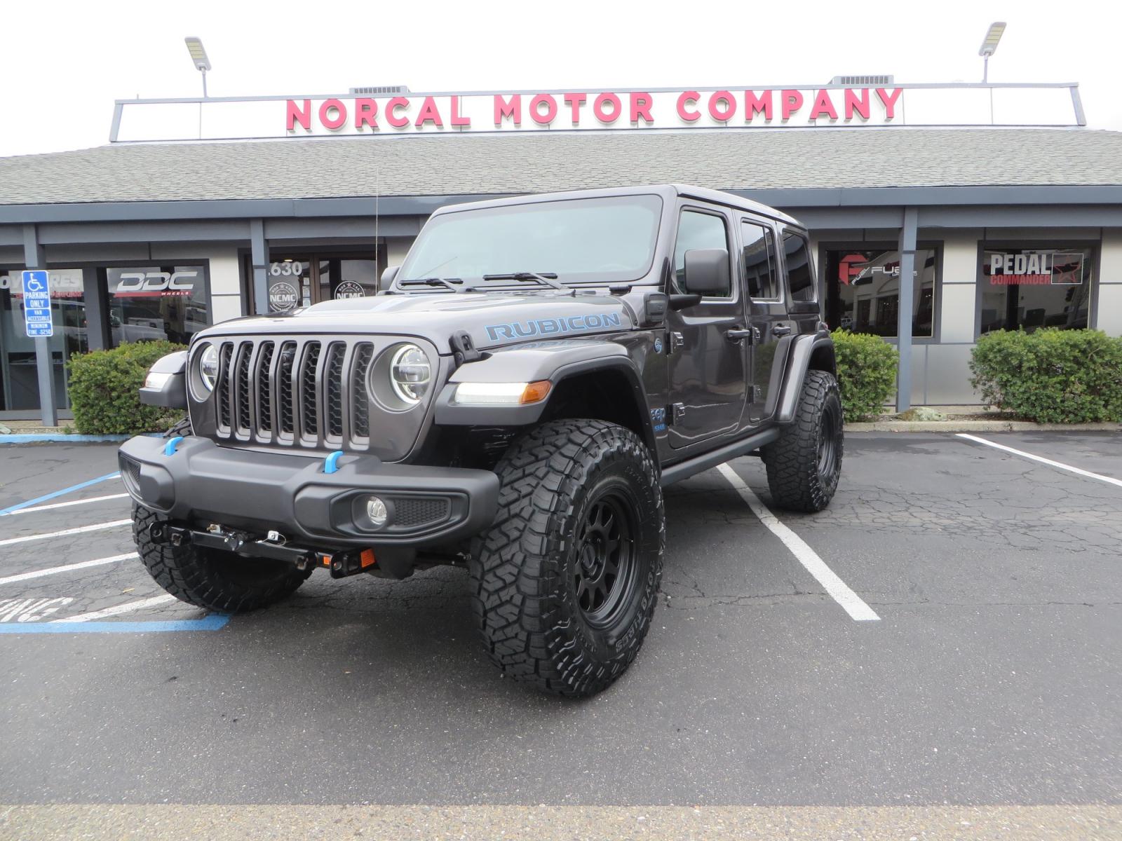 2021 CHARCOAL /BLACK Jeep Wrangler Unlimited Rubicon 4XE 4d SUV 4wd (1C4JJXR60MW) with an 2.0L L4 DOHC 16V TURBO engine, automatic transmission, located at 2630 Grass Valley Highway, Auburn, CA, 95603, (530) 508-5100, 38.937893, -121.095482 - 4XE Rubicon sitting on a Zone offroad suspension system, Fox shocks, 37" Toyo RT trail tires, 17" Method Race wheels, Teraflex Hd tire carrier, and Flat tow ready. - Photo #0